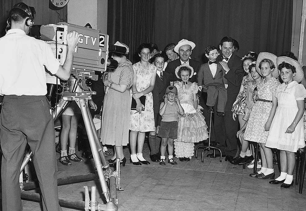Happy Hammond, Ron Blaskett and Gerry Gee with audience members during broadcasts of The Happy Show from the basement of Myer Melbourne.