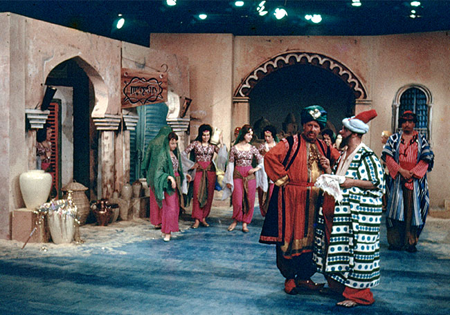 Part of the studio set for The Golden Princess. Note the colourful backgrounds and costumes for a black and white production.